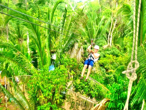 Zipline through the Belize jungle with our All Inclusive Vacation Package