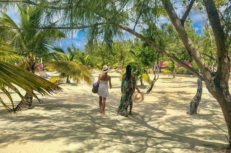 Image of two people working on Coco Plume Caye during Easer in Belize.