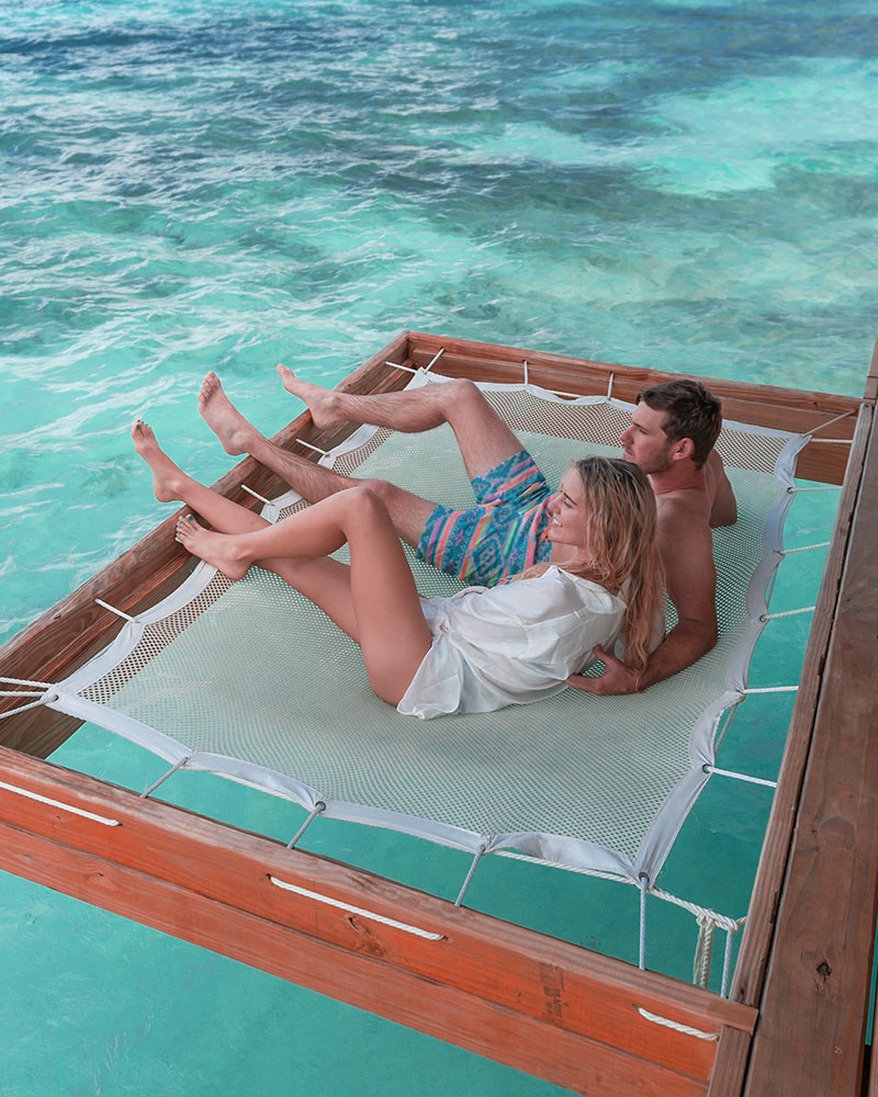 Couple enjoying the clear blue Caribbean water at Coco Plum