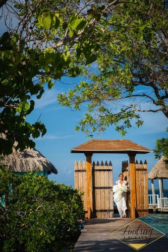 Ashely walking down the dock to her groom