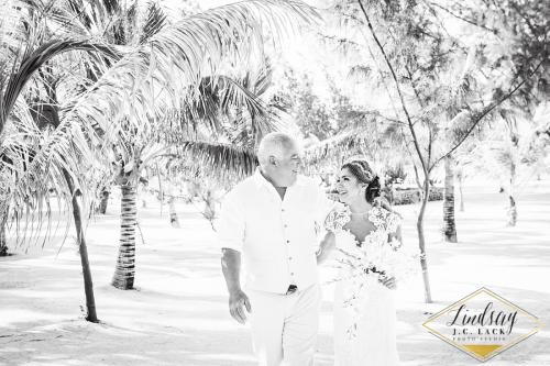 Ashley walking down the aisle with dad